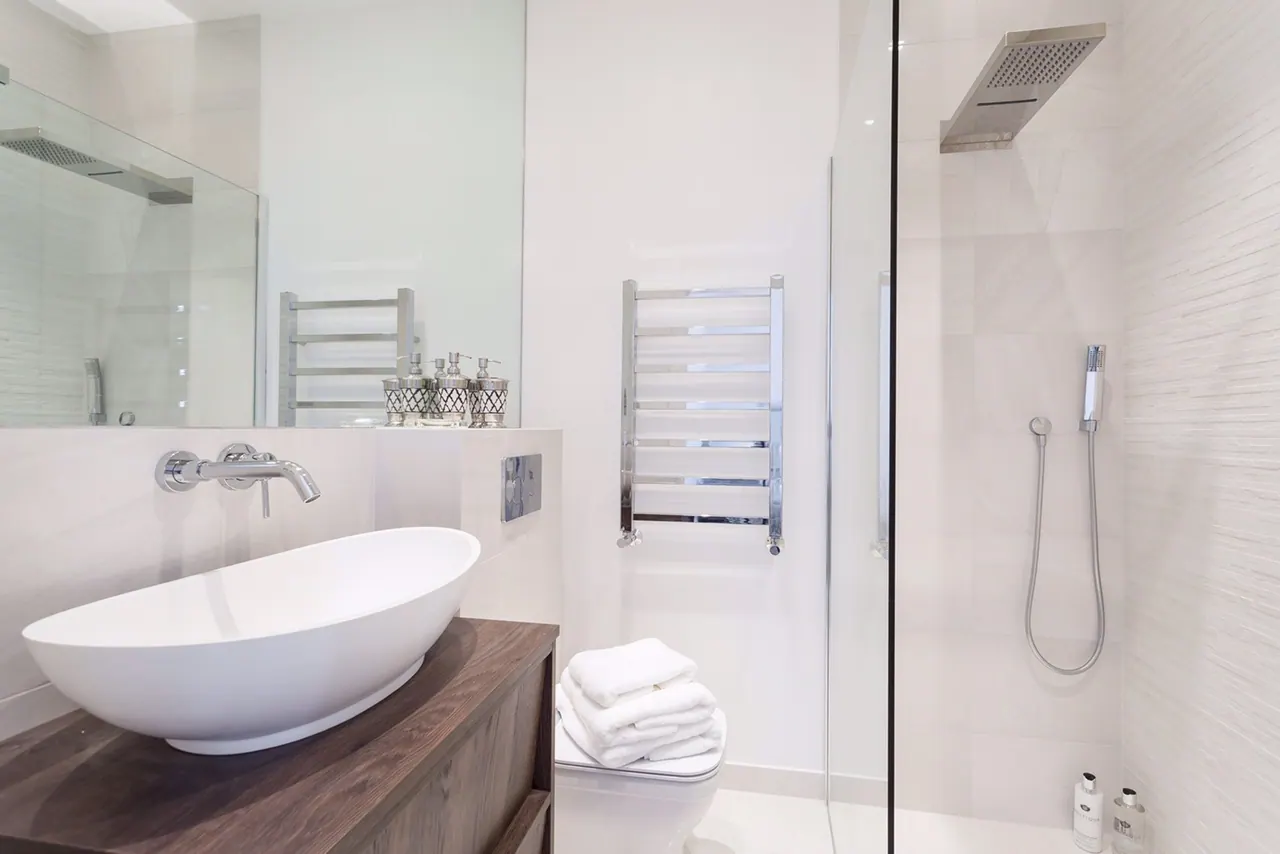 Shower room with a stone basin on a timber vanity