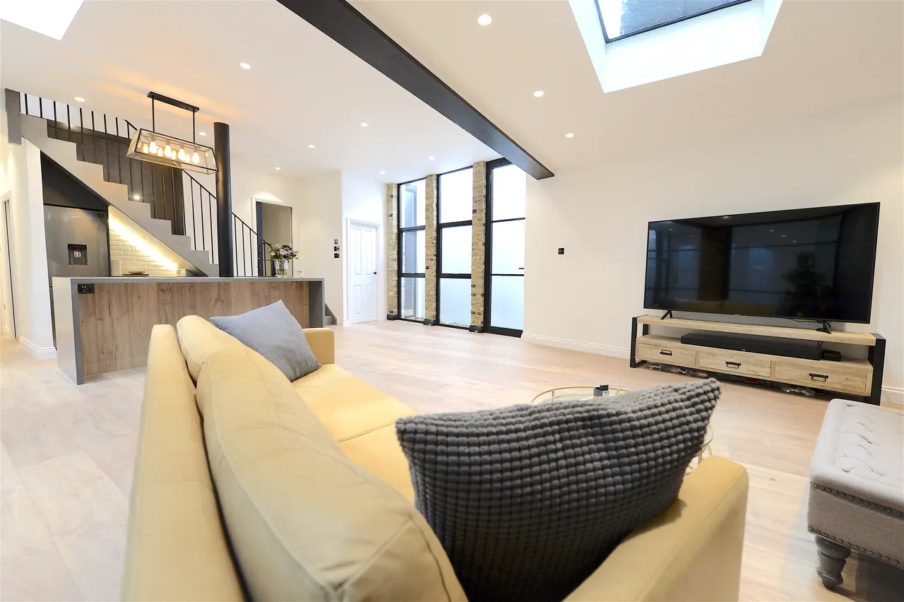 Living area with fitted joinery along the return wall